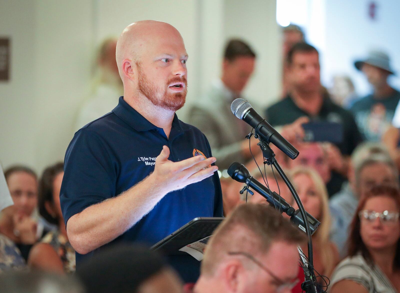 Treasure Island Mayor Tyler Payne asks a question during a briefing by the U.S. Army Corps of Engineers, Sept. 8, 2023, in Indian Shores, Fla. (Chris Urso/Tampa Bay Times via AP)