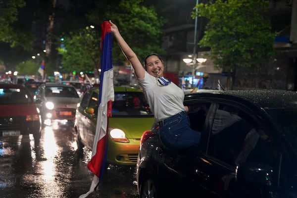 Supporters of the Broad Front (Frente Amplio) celebrate the victory of candidate Yamandú Orsi in the presidential run-off election in Montevideo, Uruguay, Sunday, Nov. 24, 2024. (AP Photo/Matilde Campodonico)