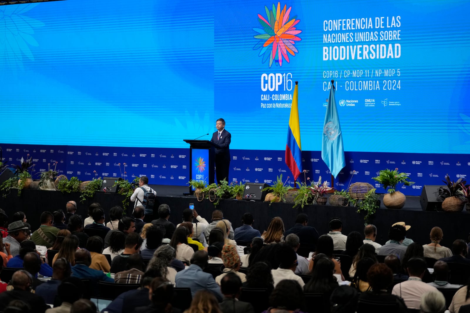 Huang Runqiu, China's minister of ecology and environment, delivers a speech at the opening ceremony of COP16, a United Nations' biodiversity conference, in Cali, Colombia, Sunday, Oct. 20, 2024. (AP Photo/Fernando Vergara)