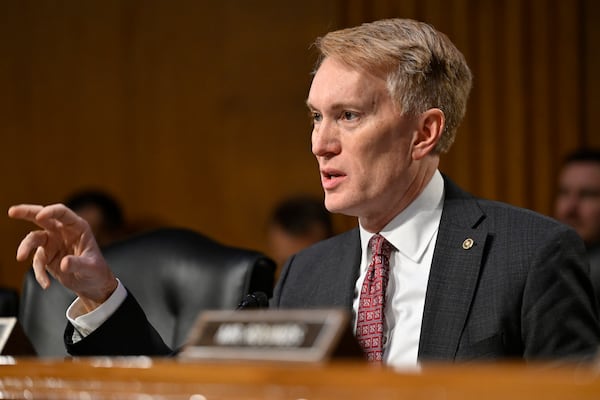 Sen. James Lankford, R-Okla., questions former Rep. Tulsi Gabbard, President Donald Trump's choice to be the Director of National Intelligence, during the Senate Intelligence Committee hearings for her confirmation at the U.S. Capitol, Thursday, Jan. 30, 2025, in Washington. (AP Photo/John McDonnell)