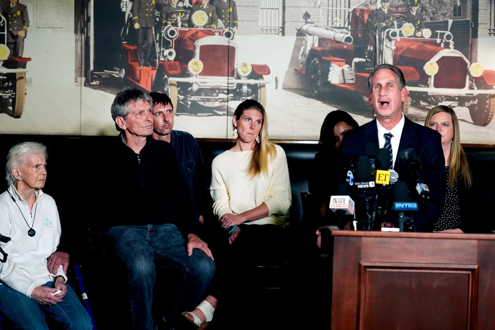 Bryan Freedman Menendez family attorney surrounded by family members talks during a news conference on Thursday, Oct. 24, 2024, in Los Angeles. (AP Photo/Damian Dovarganes)