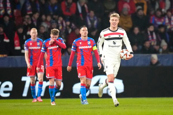 Manchester United's Rasmus Hojlund, right, celebrates after scoring his side's opening goal during the Europa League soccer match between Viktoria Plzen and Manchester United at the Doosan Arena in Plzen, Czech Republic, Thursday, Dec. 12, 2024. (AP Photo/Petr David Josek)