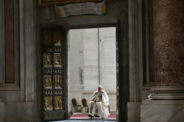 Pope Francis opens the Holy Door of St Peter's Basilica to mark the start of the Catholic Jubilee Year, at the Vatican, Dec. 24, 2024. (Alberto Pizzoli/Pool Photo via AP)