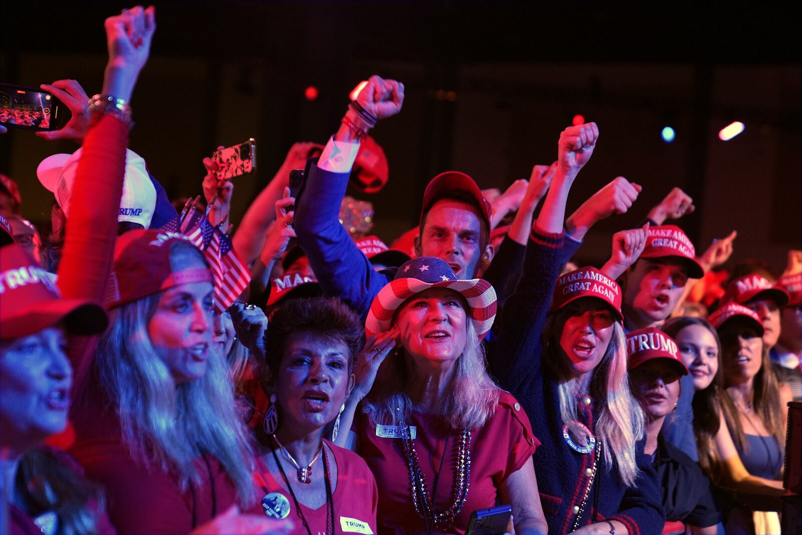 Supporters watch returns at a campaign election night watch party for Republican presidential nominee former President Donald Trump at the Palm Beach Convention Center, Wednesday, Nov. 6, 2024, in West Palm Beach, Fla. (AP Photo/Evan Vucci)