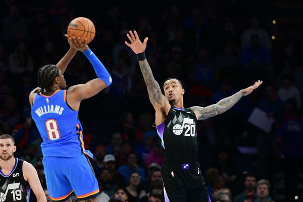 Utah Jazz forward John Collins (20 tries to block a shot by Oklahoma City Thunder forward Jalen Williams (8) during the second half of an NBA basketball game, Wednesday, Jan. 22, 2025, in Oklahoma City. (AP Photo/Kyle Phillips)