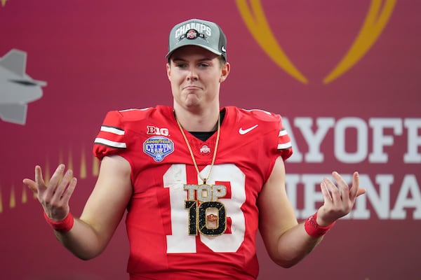 Ohio State quarterback Will Howard celebrates after the Cotton Bowl College Football Playoff semifinal game against Texas, Friday, Jan. 10, 2025, in Arlington, Texas. (AP Photo/Julio Cortez)