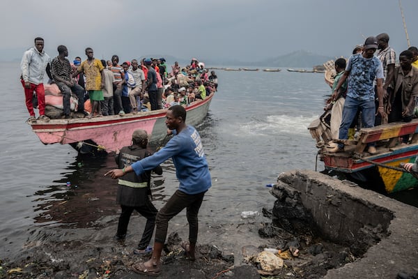 People fleeing M-23 rebel advances arrive by boat in Goma, Democratic Republic of the Congo, Wednesday, Jan. 22, 2025(AP Photo/Moses Sawasawa)