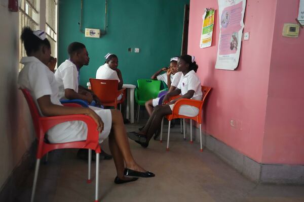 Health workers waits for children who will be administered the malaria vaccine R21/Matrix-M at the Health Centre in Yenagoa, Nigeria, Tuesday, Dec. 10, 2024. (AP Photo/Sunday Alamba)