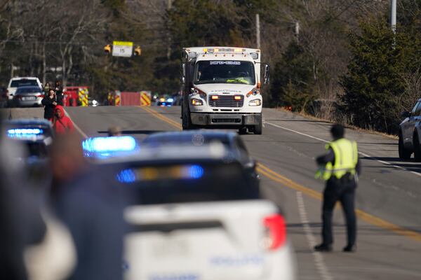 An ambulance leaves the Antioch High School following a shooting in Nashville, Tenn., Wednesday, Jan. 22, 2025. (AP Photo/George Walker IV)