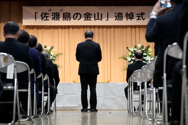 Mayor of Sado City Ryugo Watanabe delivers a speech during a memorial ceremony for the Sado Island Gold Mine in Sado, Niigata prefecture, Japan, Sunday, Nov. 24, 2024. (AP Photo/Eugene Hoshiko)