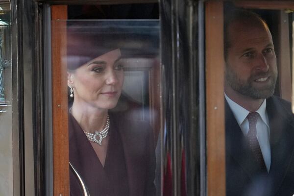 Britain's Kate, Princess of Wales and Prince William sit in a carriage after welcoming the Emir of the State of Qatar Sheikh Tamim bin Hamad Al Thani and Sheikha Jawaher bint Hamad bin Suhaim Al Thani in London, Tuesday, Dec. 3, 2024. (AP Photo/Kin Cheung, Pool)