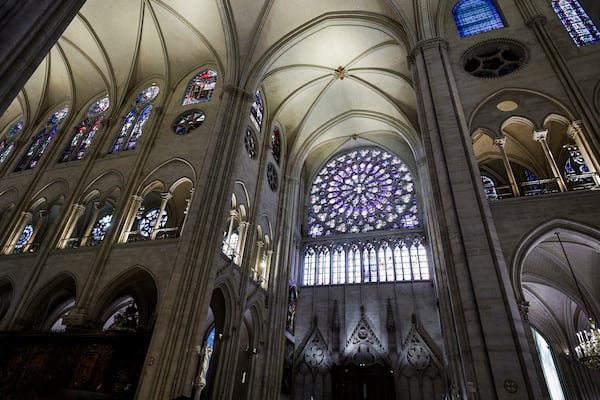 The South Rose stainglass window of Notre-Dame de Paris cathedral is seen while French President Emmanuel Macron visits the restored interiors of the cathedral, Friday Nov. 29, 2024, in Paris. (Stephane de Sakutin, Pool via AP)