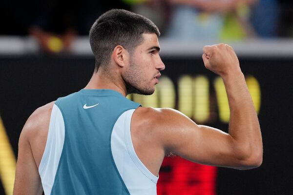 Carlos Alcaraz of Spain reacts after defeating Alexander Shevchenko of Kazakhstan in their first round match at the Australian Open tennis championship in Melbourne, Australia, Monday, Jan. 13, 2025. (AP Photo/Vincent Thian)