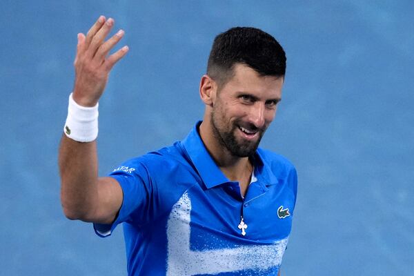 Novak Djokovic of Serbia gestures during a fourth round match against Jiri Lehecka of the Czech Republic at the Australian Open tennis championship in Melbourne, Australia, Sunday, Jan. 19, 2025. (AP Photo/Mark Baker)