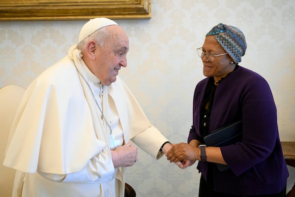 In this picture made available on Thursday, Jan. 16, 2025 by Vatican Media, Pope Francis wears a sling on his right arm, due to a fall earlier in the day, while meeting with FAO Programme Committee Chairperson on World Food Security Nosipho Nausca-Jean Jezile at The Vatican. (Vatican Media via AP, HOGP)