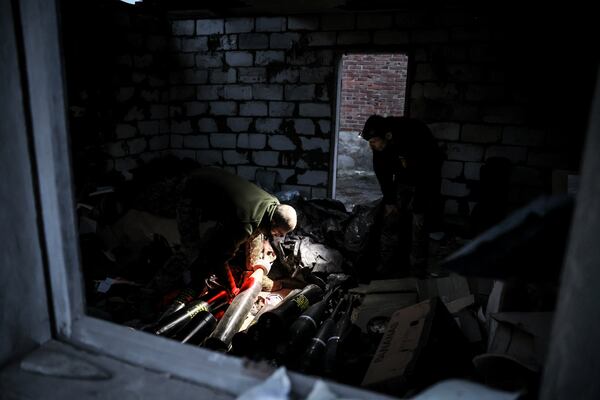 In this photo provided by Ukraine's 24th Mechanised Brigade press service, servicemen of the 24th Mechanised Brigade prepare to fire 120mm mortar towards Russian positions near Chasiv Yar town, in Donetsk region, Ukraine, Tuesday, Nov. 19, 2024. (Oleg Petrasiuk/Ukrainian 24th Mechanised Brigade via AP)