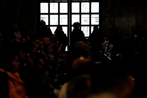 Church members attend a service at St. Rita of Cascia Parish in Chicago, Sunday, Jan. 19, 2025. (AP Photo/Nam Y. Huh)