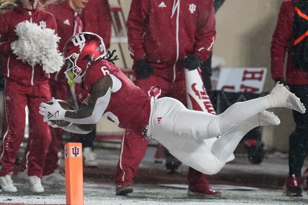 Indiana running back Justice Ellison dives during the first half of an NCAA college football game against the Purdue, Saturday, Nov. 30, 2024, in Bloomington, Ind. (AP Photo/Darron Cummings)