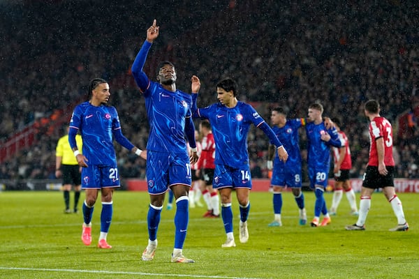 Chelsea's Noni Madueke celebrates scoring their side's third goal of the game during the Premier League soccer match between Southampton and Chelsea at St Mary's Stadium, Southampton, England, Wednesday Dec. 4, 2024. (Andrew Matthews/PA via AP)