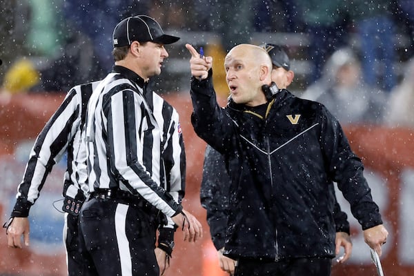 Vanderbilt head coach Clark Lea talks with a referee about a play during the second half of the Birmingham Bowl NCAA college football game against Georgia Tech, Friday, Dec. 27, 2024, in Birmingham, Ala. (AP Photo/Butch Dill)