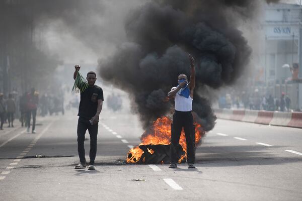 People protest in Kinshasa, Democratic Republic of the Congo Tuesday, Jan. 28, 2025, against the Rwanda-backed M23 rebels' advances into eastern Congos capital Goma.(AP Photo/Samy Ntumba Shambuyi)