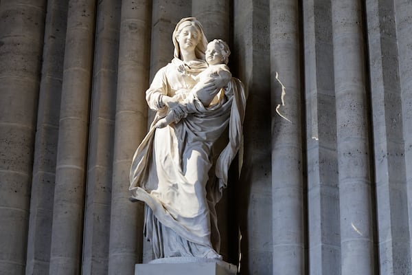 A statue is seen inside Notre-Dame de Paris cathedral while French President Emmanuel Macron visits the restored interiors of the monument, Friday Nov. 29, 2024, in Paris. (Stephane de Sakutin, Pool via AP)