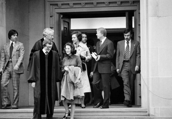 FILE - President Jimmy Carter and Rosalynn Carter chat with Rev. Charles Trentham as they leave the First Baptist Church in Washington on March 20, 1977. (AP Photo/Charles W. Harrity, File)