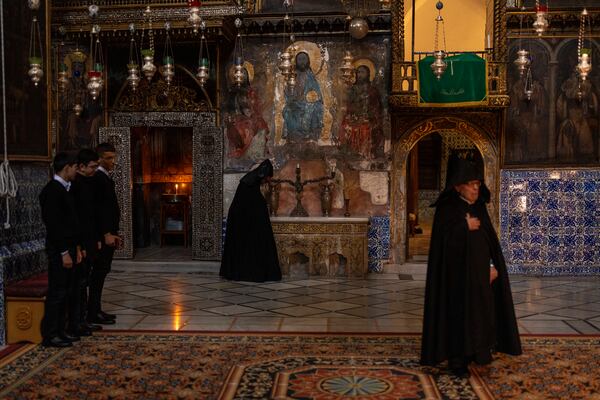 Armenian Christian clergy and young seminars attend the daily afternoon prayer service at the St. James Cathedral at the Armenian quarter in Jerusalem, Thursday, Nov. 21, 2024. (AP Photo/Francisco Seco)