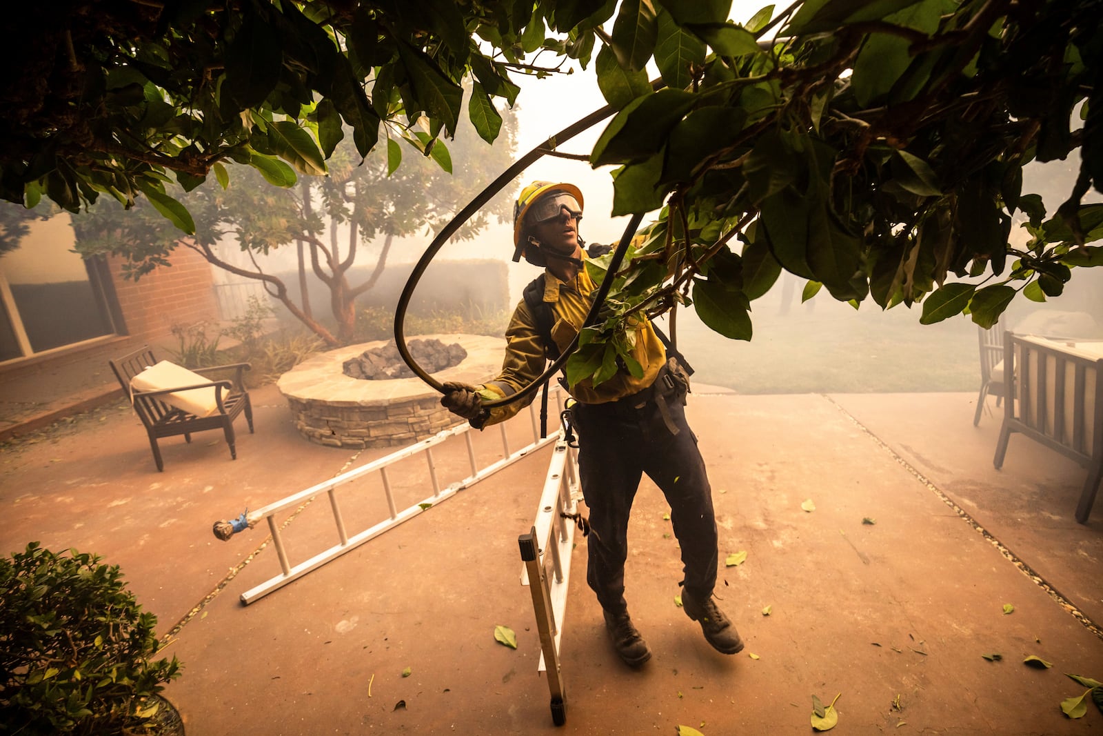 A firefighter works in the Mountain fire, Wednesday, Nov. 6, 2024, near Camarillo, Calif. (AP Photo/Ethan Swope)