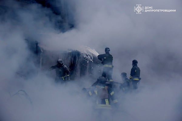 In this image provided by the Ukrainian Emergency Service, firefighters put out the fire following a Russian missile attack on the country's energy system in Dnipropetrovsk region, Ukraine, Wednesday, Dec. 25, 2024. (Ukrainian Emergency Service via AP)