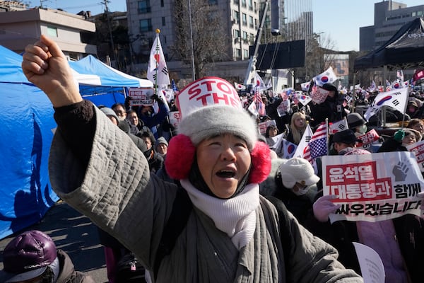 A supporter of impeached South Korean President Yoon Suk Yeol shouts slogans during a rally to oppose his impeachment near the presidential residence in Seoul, South Korea, Friday, Jan. 10, 2025. (AP Photo/Ahn Young-joon)