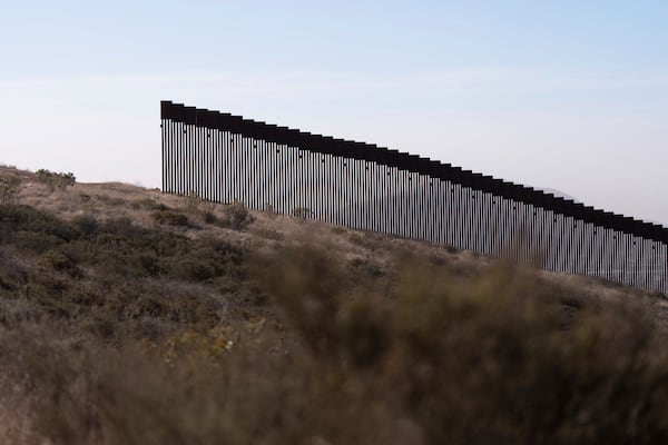 A gap in one of two border walls separating Mexico from the United States is seen Thursday, Jan. 23, 2025, in San Diego. (AP Photo/Gregory Bull)