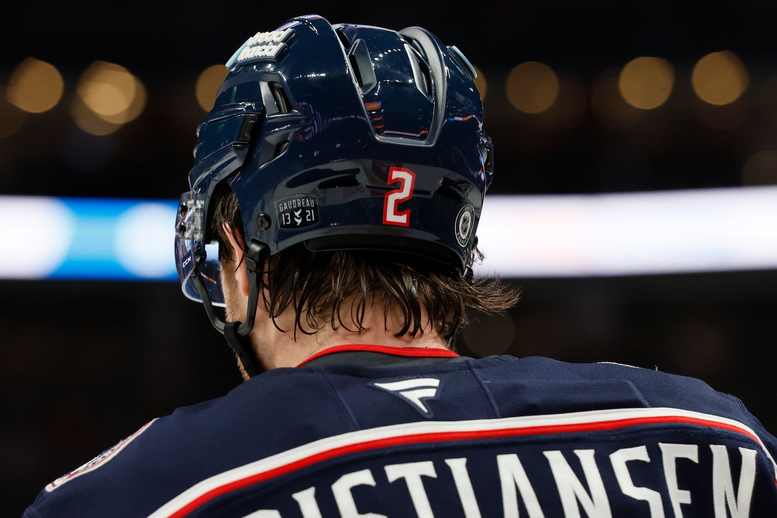 Columbus Blue Jackets players, including Jake Christiansen wear helmet stickers and patches honoring Johnny Gaudreau and his brother Matthew during the first period of an NHL hockey game against the Florida Panthers Tuesday, Oct. 15, 2024, in Columbus, Ohio. All teams in the NHL will wear helmet stickers honoring the Gaudreau brothers. (AP Photo/Jay LaPrete)