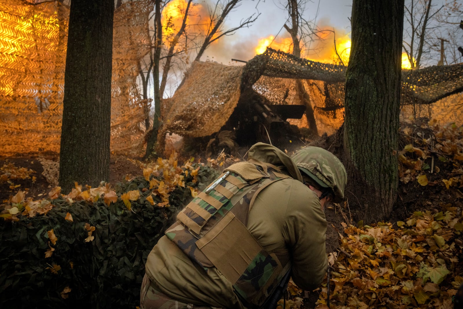 A serviceman of the 13th Brigade of the National Guard of Ukraine fires a Giatsint-B gun towards Russian positions near Kharkiv, Ukraine, Wednesday, Nov. 6, 2024. (AP Photo/Efrem Lukatsky)