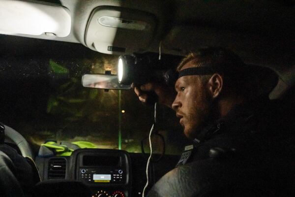 French gendarmes patrol during curfew outside Mamoudzou, Mayotte, Saturday, Dec. 21, 2024. (AP Photo/Adrienne Surprenant)