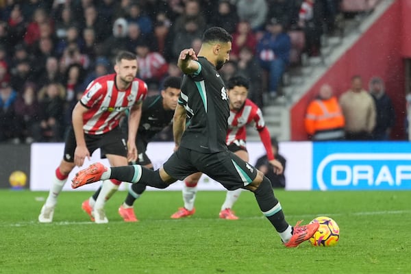 Liverpool's Mohamed Salah scores from a penalty kick during the English Premier League soccer match between Southampton and Liverpool in Southampton, England, Sunday, Nov. 24, 2024. (AP Photo/Sean Ryan)