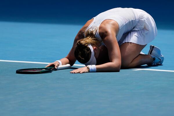 Paula Badosa of Spain reacts after winning her quarterfinal match against Coco Gauff of the U.S. at the Australian Open tennis championship in Melbourne, Australia, Tuesday, Jan. 21, 2025. (AP Photo/Vincent Thian)