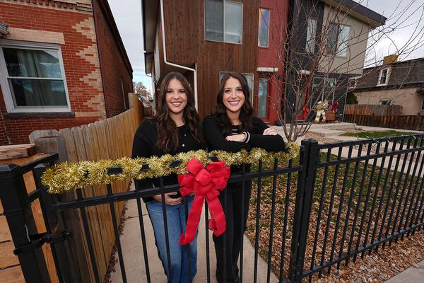 Jacqueline and Alexa Child stand for a portrait in their neighborhood Wednesday, Dec. 18, 2024, in Denver. (AP Photo/David Zalubowski)