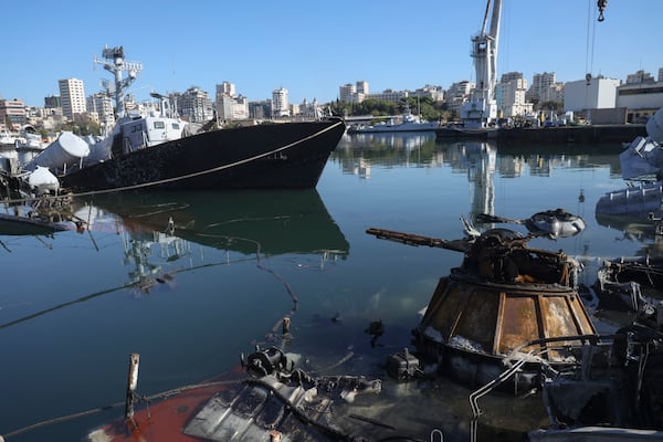 Syrian naval vessels and small civilian ships are seen destroyed by an Israeli airstrike last week in the port of Latakia, Syria, Saturday, Dec. 14, 2024. (AP Photo/Omar Albam)