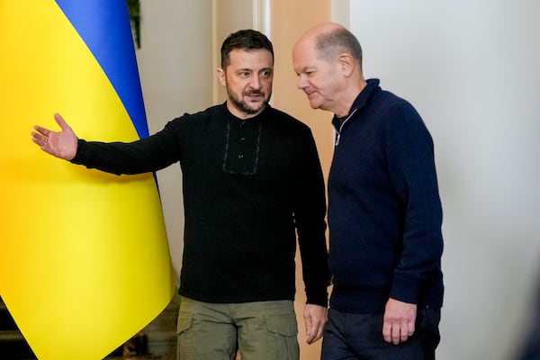 Ukraine's President Volodymyr Zelenskyy, left, and German Chancellor Olaf Scholz attend a press conference in Kyiv, Ukraine, Monday, Dec.2, 2024. (AP Photo/Evgeniy Maloletka)