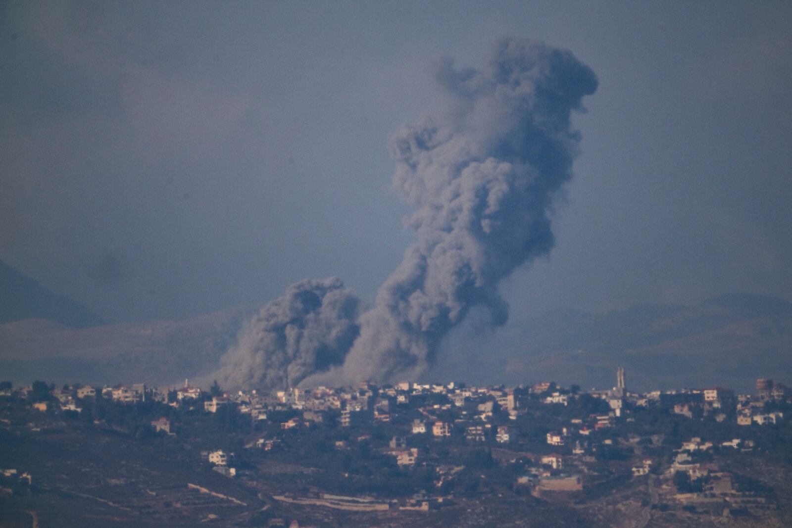 Smoke rises following Israeli bombardment in southern Lebanon as seen from northern Israel, Thursday, Oct. 17, 2024. (AP Photo/Leo Correa)