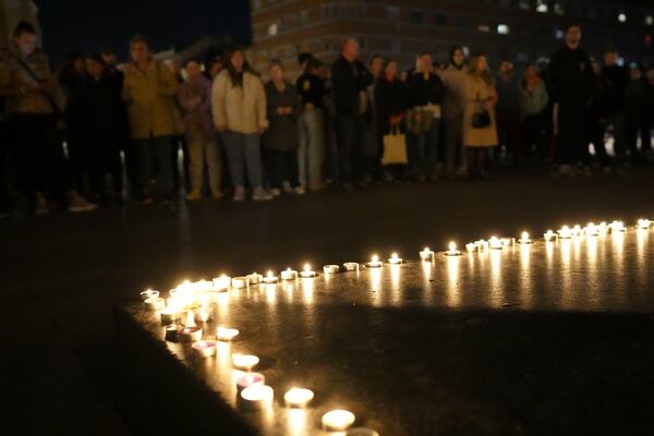 People light candles for the victims after an outdoor roof collapsed at a train station in Novi Sad, Serbia, Friday, Nov. 1, 2024. (AP Photo/Darko Vojinovic)