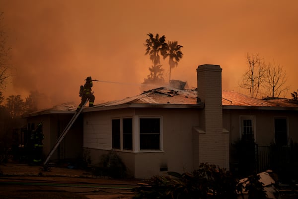 Fire crews battle the Eaton Fire as it impacts a structure Thursday, Jan. 9, 2025 in Altadena, Calif. (AP Photo/Eric Thayer)