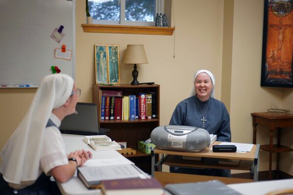 Sister Mary Gemma Harris, right, leads a class for novices at the motherhouse of the Franciscan Sisters, T.O.R. of Penance of the Sorrowful Mother, in Toronto, Ohio, Thursday, Nov. 7, 2024. (AP Photo/Jessie Wardarski)