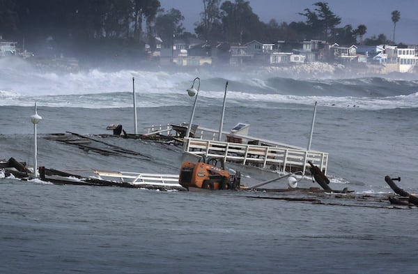 Part of a wharf and other debris floats in the ocean Monday, Dec. 23, 2024, in Santa Cruz, Calif. (Shmuel Thaler/The Santa Cruz Sentinel via AP)