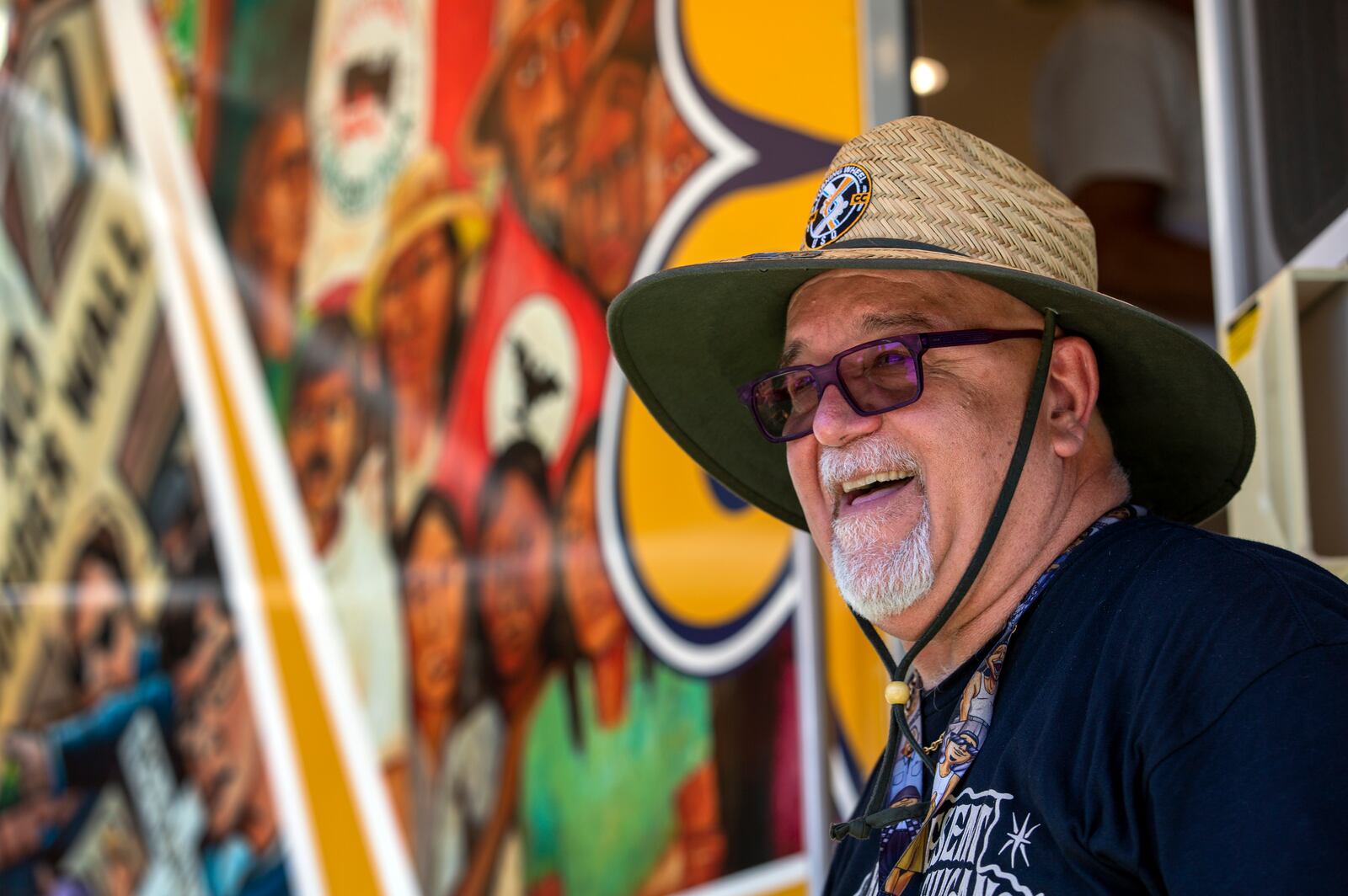 University of San Diego professor Alberto Lopez Pulido smiles while speaking with attendees of a lowrider exhibition during the 20th anniversary of Lincoln Park in El Paso, Texas, Sunday, Sept. 22, 2024. (AP Photo/Andrés Leighton)