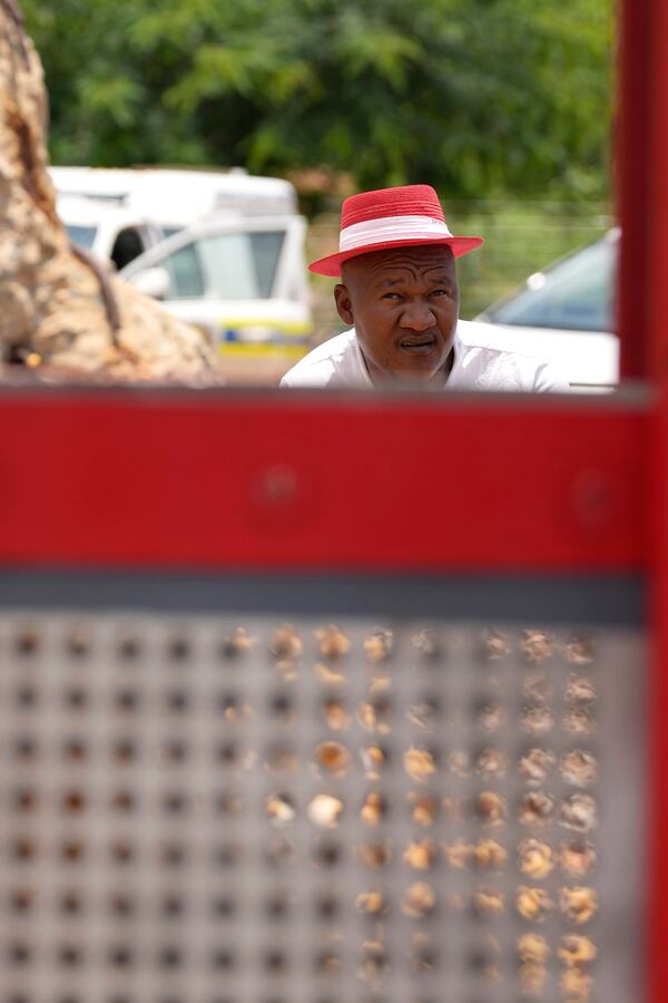 Mzwandile Mkwayi, one of the two volunteers who spent three days going up and down in a cage to bring out bodies and survivors at a mine, watches the cage being hoisted up in Stilfontein, South Africa, Thursday, Jan. 16, 2025. (AP Photo/Themba Hadebe)