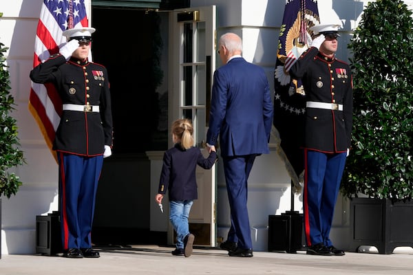 President Joe Biden, center right, departs with his grandson Beau Biden after pardoning the national Thanksgiving turkeys during a ceremony on the South Lawn of the White House in Washington, Monday, Nov. 25, 2024. (AP Photo/Mark Schiefelbein)