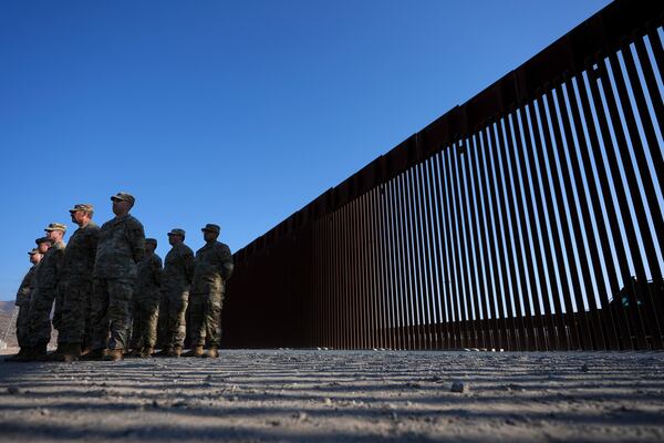 FILE - Members of the California National Guard listen during a news conference near the Otay Mesa Port of Entry along the border with Mexico, Dec. 5, 2024, in San Diego. (AP Photo/Gregory Bull, File)