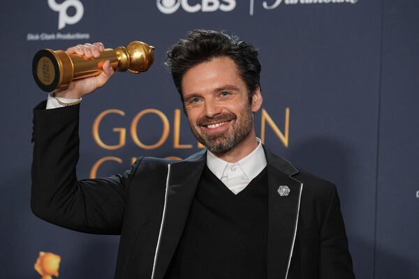 Sebastian Stan poses in the press room with the award for best performance by a male actor in a motion picture - musical or comedy for "A Different Man" during the 82nd Golden Globes on Sunday, Jan. 5, 2025, at the Beverly Hilton in Beverly Hills, Calif. (AP Photo/Chris Pizzello)